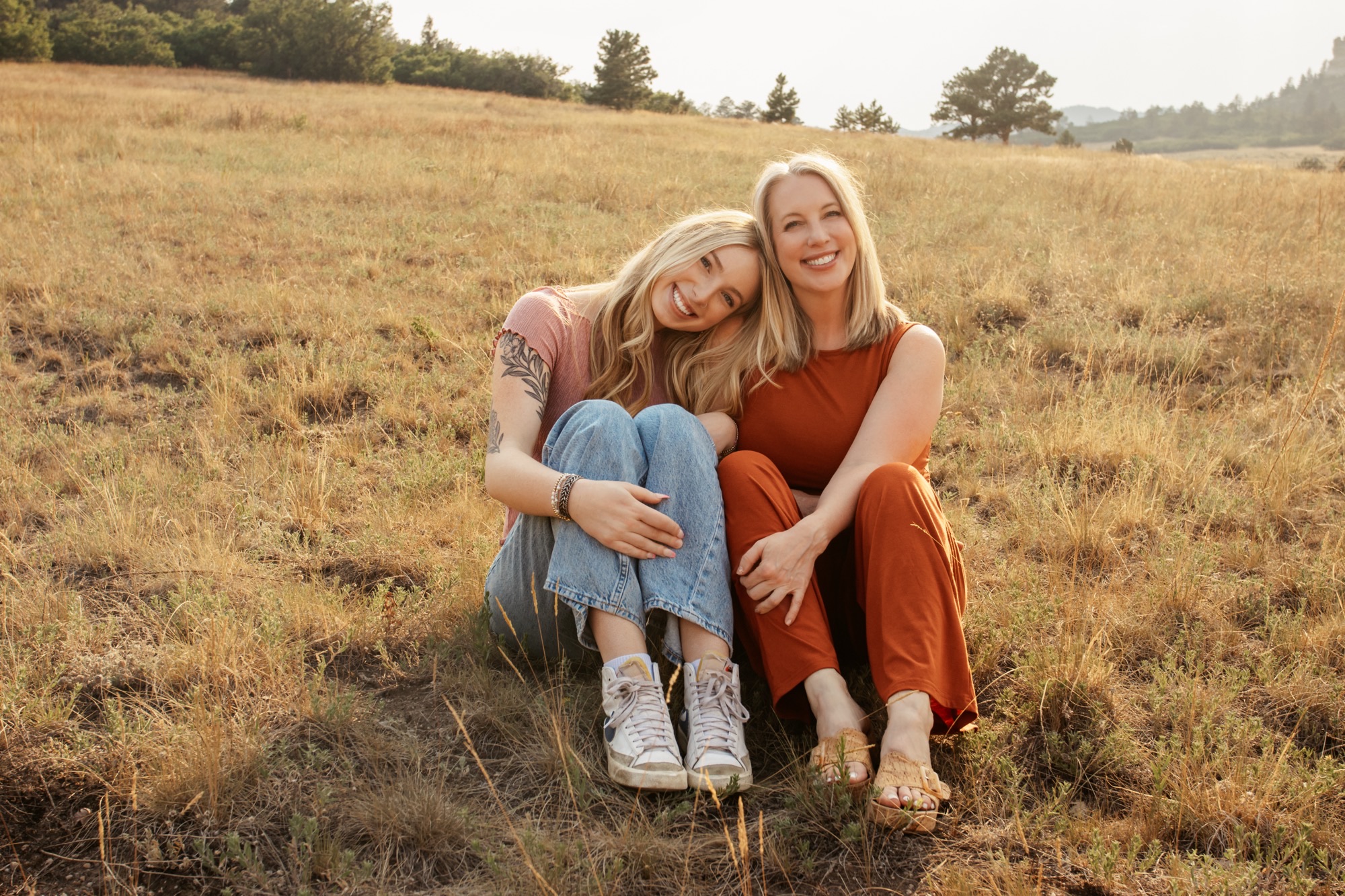 Mandy with her daughter in the Colorado foothills at sunset